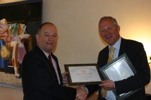 Comm. Willem Voogt, RNLN (Ret.) (r), chapter president, presents a certificate of appreciation to Pierre Hermans, CEO of Syntech International for the introduction to his company and for hosting the chapter in February.
